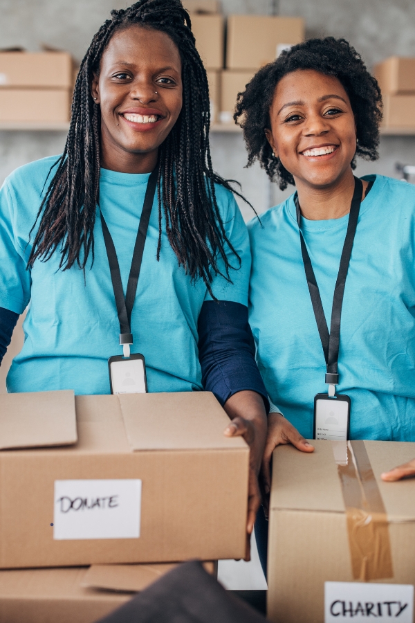 Black women donating to charity